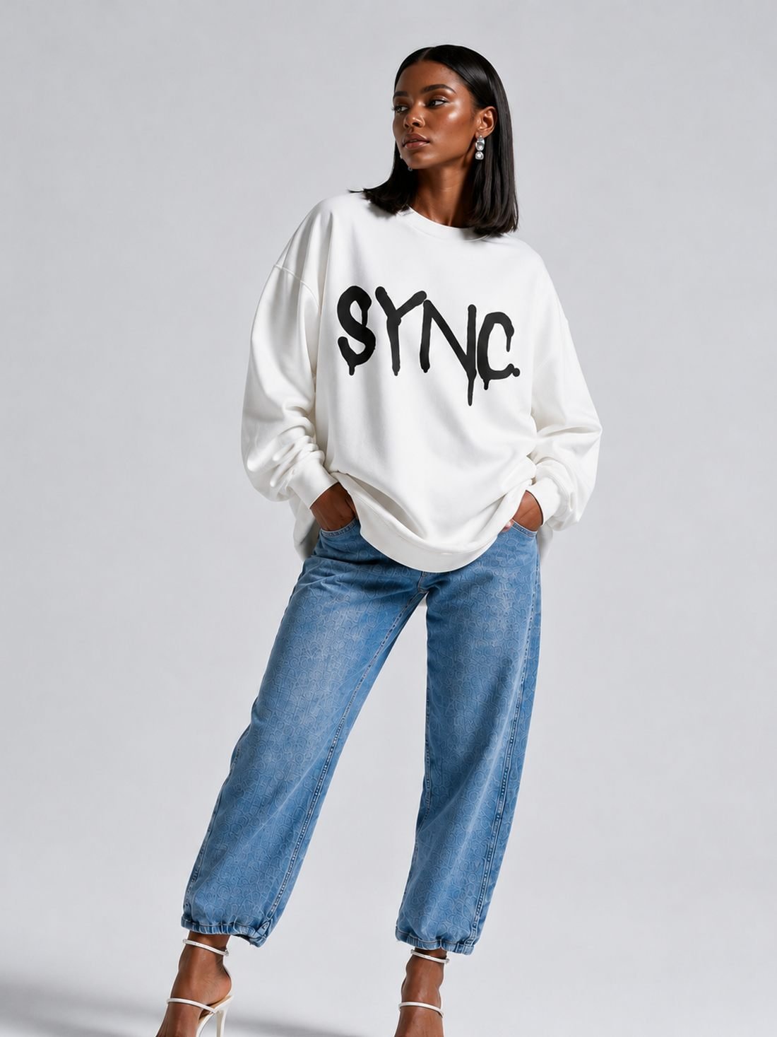 SYNC. crewneck in ivory with the SYNC. graffiti mark across the chest