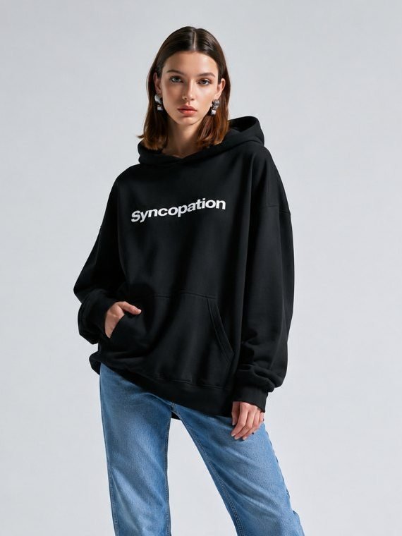 Wordmark hoodie in black, worn with the Syncopation wordmark across the chest