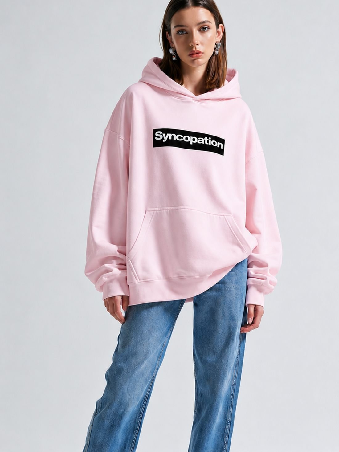 Box logo hoodie in blush pink with a black box logo across the chest