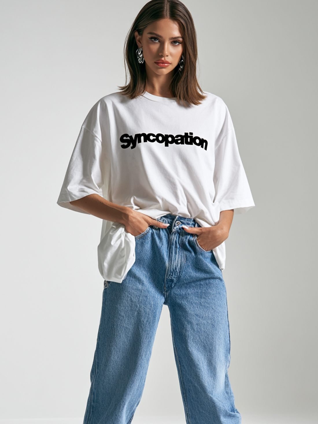 Wordmark tee in white with the Syncopation wordmark across the chest